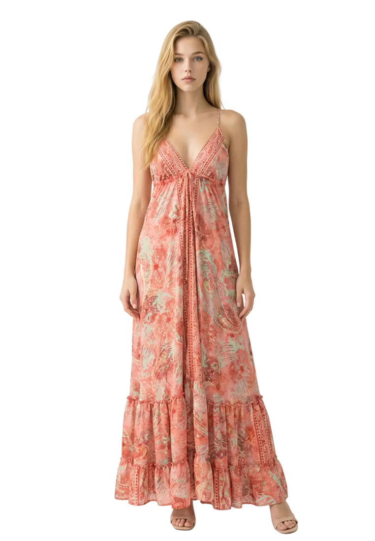 Woman wearing a floral Silk Maxi Dress from Coral Secret on a white background